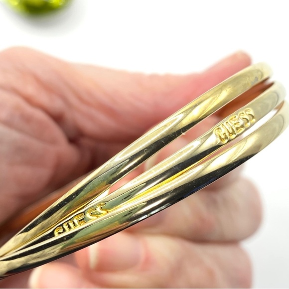 GUESS Gold Interlinked Thin Bangles Set of Three - Picture 4 of 6